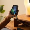 MagSafe Charger - hand placing phone on charger stand